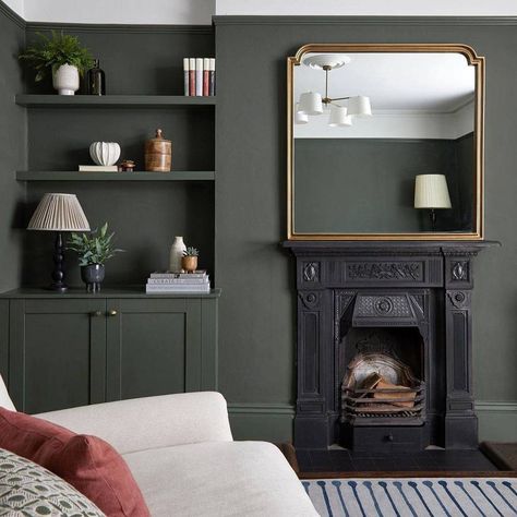 A dramatic olive green. Grounded and smokey, this green is perfect for interior and exterior colour schemes that need a botanical boost. Matt finish (2%) Durable & easy-clean Low odour & voc Easily hides imperfections Unrivalled coverage Do I need Primer? We recommend primer for any new wood, MDF, UPVC, Vinyl, or unstable looking surfaces. You’ll also need to mist-coat brand new plaster before adding your COAT colour. Olive Lounge Living Rooms, Coat Paint Brewer, Nomad Coat Paint, Coat Adulting Paint, Green Grey Black Wood Living Room, Green Living Room Dark Wood, Green Fireplace And Built Ins, Green Lounge Walls, Lounge Diner Decor