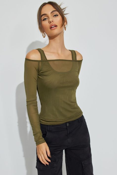 This top is absolute baddie mode. The layering options... our heads are spinning. Features - Layered Construction - Off-the-shoulder neckline - Fixed shoulder straps at underlay - Sheer mesh Size & Fit - Fit: Fit and stretch - Length: Cropped - Model is wearing size S Materials & Care - Content: 90% polyester, 10% spandex - Care: Machine wash, cold - Imported Layered Mesh Top Outfit, Mesh Long Sleeve Top Outfit, Mesh Top Outfit, Long Sleeve Top Outfit, Tank Top Layering, One Shoulder Shirt, Outfits 2000s, Mesh Long Sleeve Top, Black Mesh Top