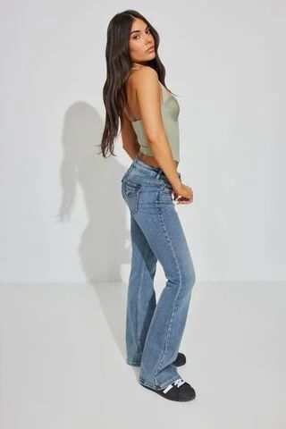 Low Rise Flare Jean - Ira Blue, Ira Blue Low Rise Flare Jeans Outfit, Low Rise Jeans Y2k, Ultra Low Rise Jeans, Bts Clothes, Retro Inspired Outfits, Flare Jeans Outfit, Outfit Pieces, Short Jean Skirt, Low Rise Flare Jeans