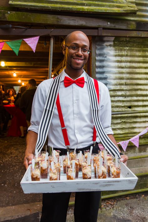 Server outfits red bow tie and suspenders with vendor trays for passed appetizers Carnival Theme Food Ideas, Circus Cocktails, Carnival Theme Party Outfit, Circus Theme Party Outfits, Server Outfits, Passed Appetizers, Deco Cinema, Circus Food, Vintage Circus Party