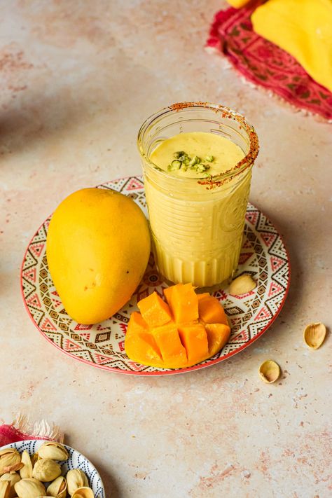 Mango lassi is a popular drink found in India, it consists of mangos, yogurt, milk and a few flavorings. A very simple recipe that is refreshing, delicious and a yummy breakfast on the go. Mango Lassi Recipes, How To Make Oats, Lassi Recipes, Indian Drinks, Yogurt Milk, Yogurt Drinks, Mango Lassi, Mango Chunks, Quick Breakfast Recipes