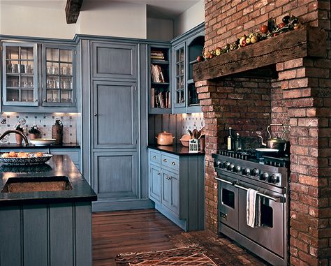 Kitchen Brick Fireplace, Brick Oven Surround Kitchen, Blue Kitchen Cabinets Brick Backsplash, Farmhouse Kitchen With White Cabinets And Brick Backsplash, Exposed Brick Fireplace Kitchen, Brick Stove Alcove, House Plans With Fireplace In The Middle, Brick Oven Kitchen Indoor, Blue And Brick Kitchen