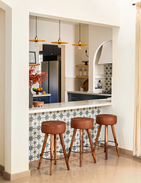 The signature element of the dining room is a breakfast counter outfitted with blue pattern tiles and leather accent bar... Spanish Villa Interior, Spanish Tile Kitchen, Black Herringbone Tile, Modern Spanish Home, Spanish Interior Design, Spanish Apartment, Spanish Interior, Spanish Kitchen, Large Sectional Sofa