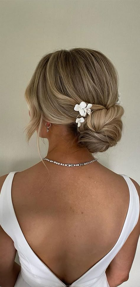 modern updo, knot updo, upstyle, sleek updo, simple sleek updo, polished updo, upstyle Side Part Updo Wedding Low Buns, Bridal Hair With Backless Dress, Flowers In Updo Wedding, Bridal Low Bun With Pearls, Bridal Updo Brunette Low Buns, Bridal Hair Low Bun Blonde, Bridal Hair Updo Low Bun, Up Do Wedding Hairstyles With Veil, Simple Updo For Wedding