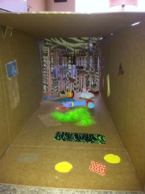 Sensory tunnel for infants. Two boxes taped together plus whatever you have on hand. I had sandpaper, feather boa, ribbon, rabbit fur (hobby lobby), reflective paper, tactile paper, fabrics, etc. Good fun for little movers. Use a hot glue gun through out to also create more tactile experiences. Sensory Tunnel, Infants Activities, Infant Room Ideas, Infant Curriculum, Infant Room, Infant Classroom, Communication Process, Baby Sensory Play, Nursery Activities