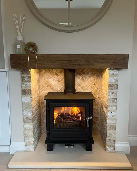 The beautifully varied tones of blend 71 in a lovely fireplace, this blend develops the white after firing, which means you will get a great variety of beige to white tones. . #fireplace #brickslips #interiors Snug With Fireplace, Log Burner Brick Slips, Different Fireplace Ideas, Fireplace With Stove Ideas, Stove In Fireplace Ideas, Chimney Alcove Ideas Living Room, Slip Brick Fireplace, Woodburner Living Room, Fireplace Chamber Ideas