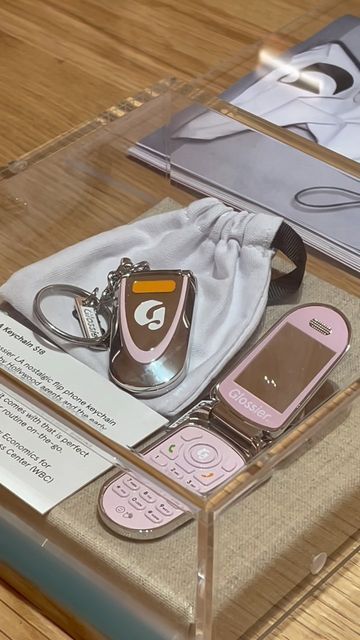 Glossier on Instagram: "Welcome to the “gift shop” at Glossier NYC, where you can find all our exclusive store merch (the Glossier LA Keychain!?) and select limited edition items (Lavender Hoodie!?) to take home for yourself. Come stop by 👋 72 Spring St in SoHo. See you there!" Glossier Accessories, Glossier Merch, Glossier Shop, Glossier Hoodie Aesthetic, Glossier Keychain, Merch Aesthetic, Glossier La Keychain, Glossier Beauty Bag, What Is My Aesthetic