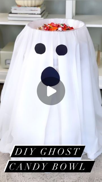 Jessica Morgan on Instagram: "Super easy DIY 🍬Ghost Candy Bowl 🍬 for Halloween. All you need is a round plastic tablecloth and 2 clear bowls, both are from @dollartree You just need to sandwich the tablecloth in between the two clear bowls. Then cut out 2 paper eyes and a mouth, and tape them onto the tablecloth. You will also need a small table to place everything on. Now just fill with candy! Be sure to follow me for more quick and easy DIY’s! . . . #dollartree #dollartreefinds #dollartreedi Halloween Bowls Ideas, Halloween Candy Buckets Diy, Ghost Candy Holder, Halloween Candy Dish Diy, Halloween Candy Bowl On Porch, Diy Halloween Candy Bowl, Halloween Candy Bowl Ideas, Trick Or Treat Candy Bowl, Ghost Candy Bowl