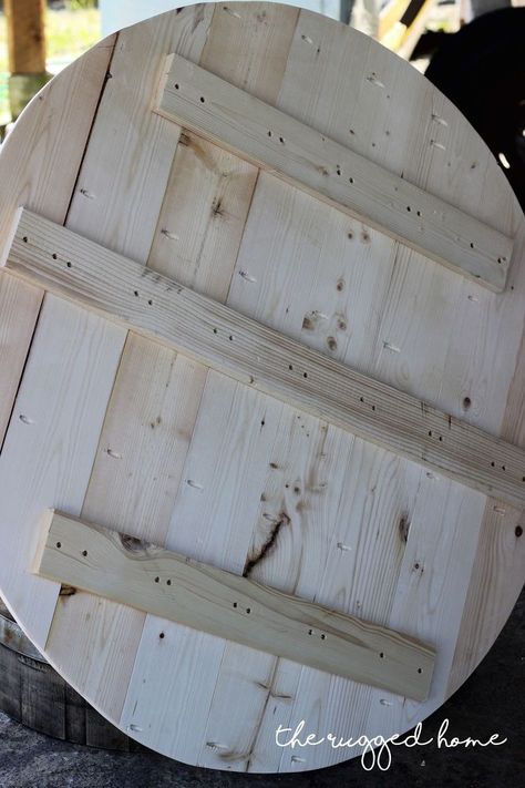 I saw this 1/2 wine barrel at a local nursery and I knew I had to turn it into a wine barrel coffee table. Sadly, I didn’t realize how bad the condition was  prior to paying almost 100.00 for it.  I immediately knew I had to make it into a wine barrel coffee table. I was envisioning this amazing farmhouse piece and while we were making it I just kept thinking “Is this actually going to turn out?“   Here’s the lovely 1/2 wine barrel after I gave it a GOOD sand down. I’m sure it could of… Diy Round Coffee Table Easy Wood, Barrel Table Ideas, Whiskey Barrel Table Top, Refurbished Coffee Tables, Wine Barrel Coffee Table, Whiskey Barrel Table, Wine Barrel Table, Barrel Coffee Table, Metal Blinds