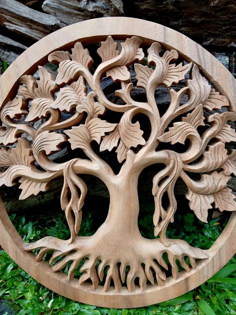 Tree of life wall art was imagined by our shop here in Ubud Bali  local artists here are very creative and come up with new concepts all the time Bali is one of the remaining  world ,renowned wood carving centers in the world the people have learned the carving techniques by passing them down through generations. The culture is a version of Hindu that emphasizes family community and religion For this reason the artistic creativity is over the top and time is not always as critical as a perfect piece of art. Tree of life wall art is made from tropical suar wood (albesia zaman ). Grown environmentally sustainable. Processing time  Order will be processing in 1-7 business days  SPECIFICATION Material : suar wood  Color     : Brown and natural Dimension : 16"x16"x0.8"  CUSTOMS & IMPORT TAXES F Tree Of Life Carving, Wooden Tree Of Life Wall Art, Tree Artwork Sculpture Wood Carvings, Tree Of Life Sculpture, Tree Of Life Sculptures & Statues, Tree Of Life Wall Art, Carving Techniques, Chip Carving, Ubud Bali