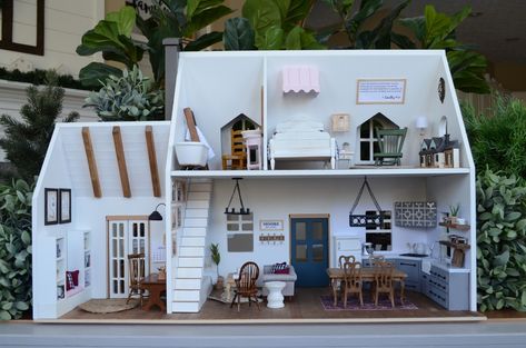 @miniadventurescompany posted to Instagram: One of our favorite projects was this Hearth and Hand dollhouse we customized for Ashley's @moorehouseinteriors daughter Emma. Shoot us a DM if you're interested in a  custom dollhouse of your own.  .  .  .    #miniadventuresco #dollhouse #dollhouseminiatures #miniatures #dollhousediy #dollhousedecor #dollhousefurniture #moderndollhouse #dollhousereno #stylingmydollhouse #oneinchscale #onetwelthscale #puppenhaus #smallshop #giftsforgirls #designerdollh Hearth And Hand Dollhouse, Ikea Dollhouse, Diy Barbie House, Moore House, Doll Furniture Diy, Doll House Plans, Mini Doll House, Doll House Crafts, Dolls House Interiors