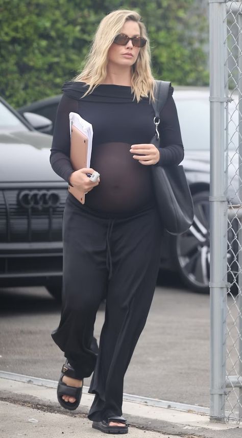 Margot Robbie's Sheer Top Remixes Maternity Wear For Millennials Margot Robbie Pregnant Outfits, Margot Robbie Pregnant 2024, Pregnancy Fits, Tom Ackerley, Celebrity Maternity Style, Sheer Black Shirt, Charcoal Grey Dress, Pregnancy Bump, Preggo Fashion