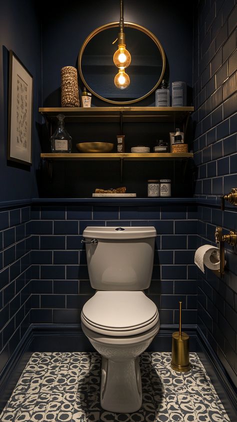 Small powder room with navy tiles, white toilet, vintage mirror, golden shelf, and grey patterned floor tiles. Modern decor. Navy Blue And Gold Small Bathroom, Powder Room Tiles Ideas, Half Bathroom Ideas Navy, Powder Room Ideas Gold Accents, Small Bathroom Art Deco, Navy Blue Gold Bathroom, Wallpaper Boys Bathroom, Tiled Half Bath, Small Bathroom Navy