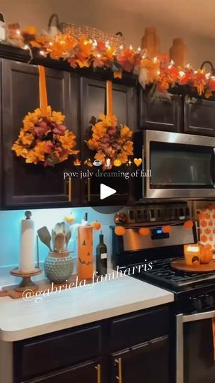 14K views · 4.6K reactions | Autumn 🍂🍁🕯️☕️🧦🧸🧡…. #inspo   -Wreath & ribbon from Hobby Lobby  -Garland over cabinet from Hobby Lobby. Placed on a orange pool noodle to get layered look. -Jars from Dollar Tree, added pumpkins on top of lid. -Pumpkin plates from hobby lobby  -ladder on counter from Hobby Lobby  -mugs from Homegoods & Marshalls  . . . . . . . #fall #falldecor #fallstyle #fallhaul #kitchenfall #fallkitchen #autumn #autumnvibes🍁 #autumnaesthetic #autumndecor #fallhomedecor #pumpkin #pumpkinspice #pumpkinaesthetic #fallgarland #wreath #diywreath #fallwreath #christmas #christmaswreath #diyfall #thanksgiving #thanksgivingaesthetic #thanksgingdecor  #fallcoffee #coffeebar #diychristmas #fallinspo | 𝐆𝐀𝐁𝐑𝐈𝐄𝐋𝐀 | gabriela.harrisfam · Original audio Fall Wreaths For Kitchen Cabinets, Garland Above Kitchen Cabinets, Hobby Lobby Fall Decor Ideas, Hobby Lobby Fall Decor, Fall Decor Kitchen, Wreath Kitchen, Thanksgiving Decorations Diy, Diy Thanksgiving, Fall Garland