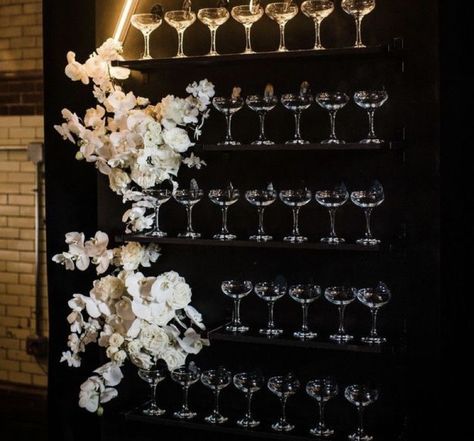 Champagne wall with flowrs black drop Black Champagne Wall, Champagne Tie, Champagne Wall, Bachelorette Ideas, Champagne Gold, Black Wedding, Wedding Themes, Champagne, Ceiling Lights