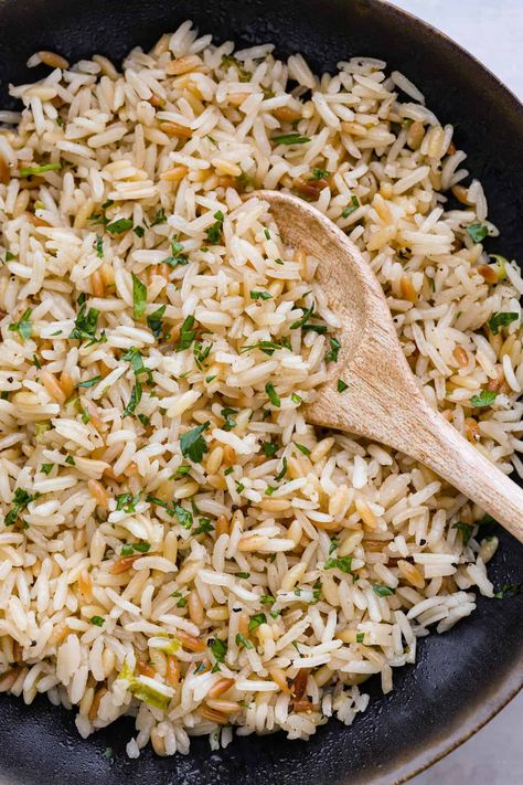 The combination of tender rice, toasty orzo, savory chicken broth, and aromatic green onions creates a mouth-watering medley that will have you coming back for seconds (and maybe even thirds!). Trust me, this rice pilaf will become a staple side dish in your kitchen once you give it a try. It's perfect for pairing with all of your favorite meals! Rice Pilaf With Orzo, Rice Recipes Side, Cheesy Zucchini Rice, Ww Sides, Meal Sides, Toasted Chickpeas, Pasta Side, Rice Pilaf Recipe, Delicious Sides