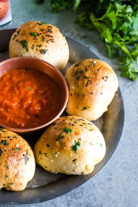 These Mozzarella Pizza Rolls take finger food to a whole new level. Best of all - they're not only delicious but so quick and easy to make and can be reheated a day later. A soft pizza roll is brushed with a garlic parsley butter and stuffed with tomato sauce and a melty Mozzarella Bite. This will be your new favorite comforting treat! #appetizer #pizzaroll | See this and other delicious recipes at TheSeasideBaker.com Stuffed Pizza Rolls, Parsley Butter, Meatball Stroganoff, Stuffed Pizza, Pizza Crust Dough, Garlic Rolls, Mozzarella Pizza, Baked Recipes, Frozen Snack