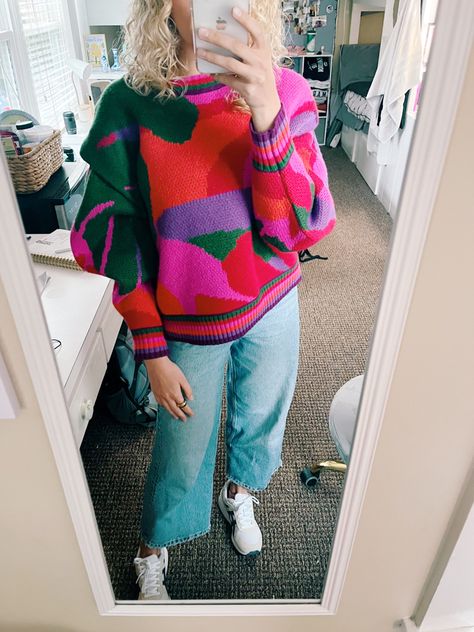 Colorful sweater, farm rio sweater, colorful outfit, chunky jewelry, retro aesthetic, retro outfit aesthetic, bold color outfit, spring sweaters, sweater aesthetic, wide leg jeans, asics sneakers Aesthetic Wide Leg Jeans, Colorful Sweater Outfit, Graphic Sweater Outfit, Aesthetic Retro Outfit, Spring Sweaters, Sweater Aesthetic, Bright Colored Outfits, Sweater Colorful, Retro Outfit