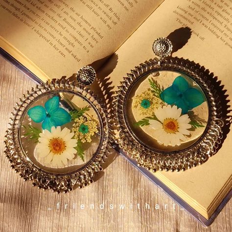 Big Floral Chandbalis 🌺💫 Size- 8cm in width & 10cm in length D.M. to place order. Customization available . #handmadejewelry #realflowerjewelry #natureinspired #shopsmall #uniquegifts #resinearrings #resinjhumka #chandbalis #driedflowers #kolkata [Resin pendants, real flower jewelry, floral jewelry, dainty jewelry, gifts, small business, resin Chandbali, resin earring, resin jhumka, Chandbali] Big Floral, Resin Earring, Resin Pendants, Real Flower Jewelry, Jewelry Dainty, Floral Jewelry, Flower Jewelry, Floral Jewellery, Resin Pendant