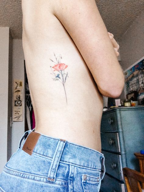 Wildflower Tattoo on Ribs Wildflower Tattoo Ribcage, Rib Cage Flowers Tattoo, Flower Rib Tattoo Color, Ribcage With Flowers Tattoo, Bouquet Of Flowers Tattoo Ribs, Dainty Wildflower Tattoo Ribs, Tattoo On Ribs, Plant Tattoos, Tattoos Simple