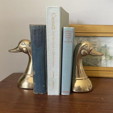 Vintage pair brass duck bookends ~5.75 in tall 🏷$58 Comment “VINTAGE” for a link to shop! Duck Bookends, Duck Decor, Thrifted Home Decor, Living Room Redo, Vintage Bookends, Home Goods Store, Book Ends, Room Redo, Bookends