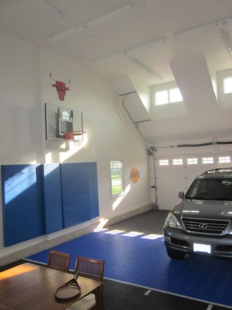 Basketball court in garage.  Not quite a half court, most of the 3 point line fits. The last issue of Houzz.com featured ideas for indoor basketball courts in your home.  I thought i would post a picture of our hoop in our garage (a 3 car tandem).  The Sport Court flooring has been awesome you just hose it off if it gets dirty. Home Basketball Court, Outdoor Basketball Court, Basketball Floor, Basketball Room, Basketball Tricks, Garage Addition, Tandem Garage, Indoor Basketball Court, Basketball Courts