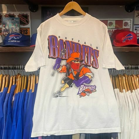 Vintage Nhl 1996 Buffalo Bandits Shirt, Unisex T-Shirt Sweatshirt Hoodie, Vintage Shirt For Men Women, Birthday Gift, Graphic Tees, Fan Gift Reprinted Shirt Made By Gildan Brand 5.3-Ounce, 100% Cotton (99/1 Cotton/Poly (Ash) & 90/10 Cotton/Poly (Sport Grey) Heavyweight Classic Unisex Tee Taped Neck And Shoulders; Tearaway Label Decoration Type: Digital Print Vintage Sports Tshirt, Vintage Sports Shirts, Vintage Sports Tees, Buffalo Bandits, Vintage College Shirts, College Shirt, Christian Book, College Apparel, College Shirts