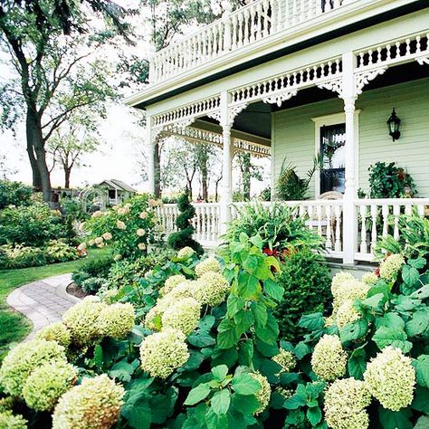 Match Your Plants        Architectural style gives clues on what types of plants to grow. For example, opulent peonies, hydrangeas, and old-fashioned roses fit well with Victorian homes. If you have a contemporary dwelling, try plants that have interesting structure, such as upright ornamental grasses. Front Porch Garden, Small Front Yard Landscaping, Small Front Yard, Front Yard Design, Front Yard Garden Design, Victorian Home, Porch Garden, Home Landscaping, Front Yard Garden