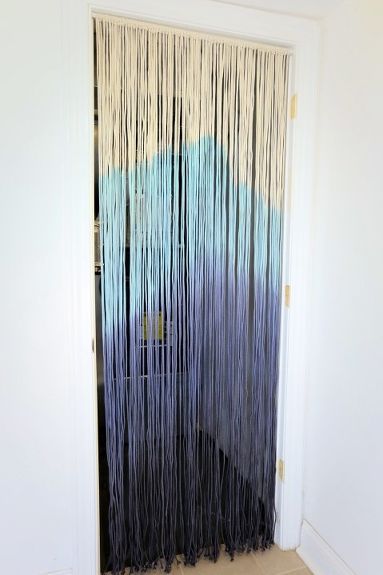 Need to hide a closet or a creepy space? Try this fun, easy, and stylish string curtain! Want an easy way to hide the adjoining room? A closet? A space you just don't want to see? Fill it with some clothesline and some fabric dye! A handful of time ago, I removed a door from our super creepy utility closet that swung into our beyond-miniscule, terribly laid out, so inefficient laundry room. It was taking up extra space and as I seem to have a running thing with removing swinging do… Door Curtains Diy, Shower Curtain With Valance, Ideas Armario, String Curtains, Coastal Dining, No Sew Curtains, Drop Cloth Curtains, Initial Tattoo, Blue Dye