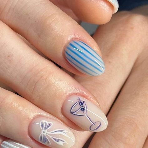 🐝Bees Knees Nails🐝 on Instagram: "🩵💙🤍🍸🎀🤍💙🩵  What do a martini glass and a bow have in common? They both belong on NAILS!! 🫶🏼  @brillbirdusa latte white gel & brush & go @peppigel gels  #Naildesigns #nails #nailsofinstagram #nailart #nailsoftheday #athomemani #manicure #diymani #glittermani #glitternails #glitterombre #ombrenails #nailsonfleek #shimmer #glitter #nailfie #summernails #nailitdaily #gelnails #gelart #buildergel #springnails #bachelorettenails #stripednails #bluenails #martininails #bownails #vacationnails" Martini Glass Nail Art, Summer Bow Nails, Martini Nail Art, Martini Glass Nails, Martini Nails Designs, 50s Nails Design, Blue Stripe Nails, Parisian Nails, Stripe Nail Designs