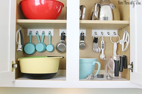 Dedicate a cabinet to organize your baking equipment and take advantage of the vertical space by hanging up your measuring utensils. | via @twotwentyone Kitchen Cabinets Storage Organizers, Easy Home Organization, Kitchen Cabinet Organization Ideas, Organisation Hacks, Kitchen Cabinet Organization, Diy Kitchen Cabinets, Kitchen Cabinet Storage, Trendy Kitchen, Cabinets Organization