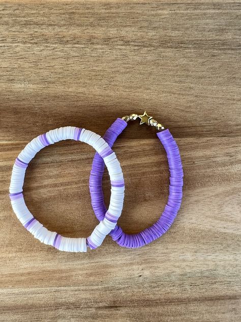 Set of Two bracelets, stretchy band.  One fits most. Is approximately 6.5 inches long. Elaatoc band ! Thank you for supporting my small business. Please see me other listings and add me on Instagram. Thank you Thread Bracelets Simple, Cute Purple Bracelet Ideas, Yellow And Purple Clay Bead Bracelet, Clay Bead Bracelet Ideas Aesthetic Purple, Clay Bracelet Ideas Purple, Bracelet Ideas For Small Business, Small Business Bracelets, Purple Bracelet Ideas Clay Beads, Cool Clay Bead Bracelet Ideas