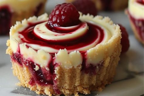 Berry Swirl Cheesecake Bites - recipestasteful Holiday Cheesecake, Berry Bites, Vanilla Wafer Crust, Air Fryer Recipes Dessert, Cheesecake Bites Recipe, Christmas Cheesecake, Vanilla Wafer, Swirl Cheesecake, Lemon Cookies Recipes