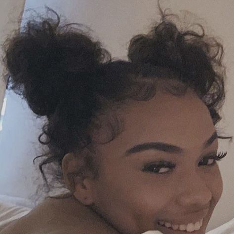 Voluminous Curls, Gorgeous Colors: A Curly Hair Color Guide 2 Messy Buns Curly Hair, Space Buns With Edges, Space Bun Hairstyles For Black Women, Two Space Buns Curly Hair, Messy Space Buns Curly Hair, Two Low Buns Curly Hair, Curly Space Buns Black Women, Two Buns Hairstyle Tutorials, 2 Buns Hairstyle Black Natural Hair