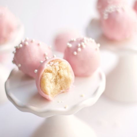 These Sugar Cookie Truffles are made of delicious and chewy sugar cookies mixed with cream cheese and dipped in chocolate. Spring Truffles, Pink Truffles, Sugar Cookie Truffles, Pillsbury Sugar Cookie Dough, Pink Baking, Starbucks Cake Pops, Empire Cookie, Pillsbury Sugar Cookies, Cookie Truffles