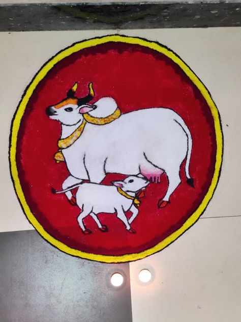 Cow and her calf nursing  shown against a red background of a circle Rangoli For Vasubaras, Vasubaras Rangoli Design, Vagh Baras Rangoli, Baras Rangoli, Vasu Baras Rangoli, Pongal Designs, Vasubaras Rangoli, Art Rangoli, Easy Diwali Rangoli