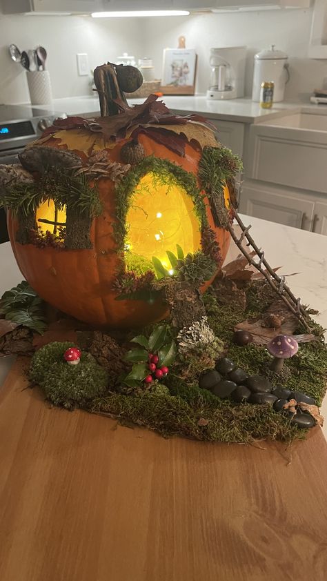 A pumpkin cottage any fairy would love. 🍄 All you need is a pumpkin, somethings from outside and your imagination. #fairyhouse #cottagecore #fairycore #naturecrafts ##autumncrafts #cozyfairyhouse Fairy Garden Pumpkin, Painting Ideas Pumpkin, Pumpkin Houses, Fairy Pumpkin, Pumpkin Diorama, Fall Pumpkins Painting, Pumpkin Fairy House, Pumpkin Fairy, Halloween Pumpkin Crafts