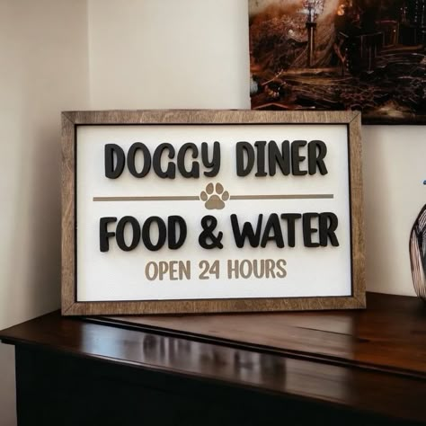 "Spruce up your dogs eating area with this cute sign. This sign is measures 12x8\". It is made of lightweight MDF and can be hung on the wall or placed on a shelf. Indoor use only. 15% of our sales go to a local rescue!" Dog Wall Ideas, Diy Dog Decor, Dog Eating Area, Dog Wall Decor Ideas, Dog Food Area, Glowforge Aura, Outdoor Dog Area, Dogs Eating, Dog Food Station