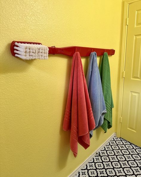 Giant Toothbrush Diy, Creative Towel Rack Ideas, Kaarin Joy, Funky Decorating Ideas, Bathroom Maximalist, Small Colorful Bathroom, Giant Toothbrush, Funky Bathroom Decor, Dopamine Decorating