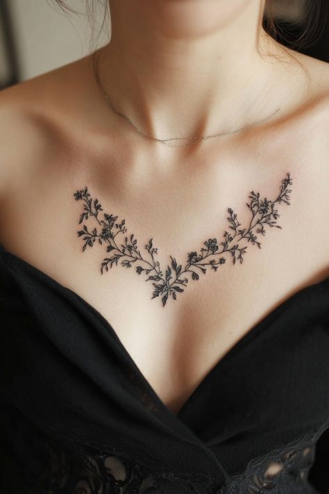 Delicate floral tattoo on a woman's upper chest above a black neckline. Small Chest Tattoo Female Simple, Tattoo Ideas Female On Chest, Intricate Back Tattoo, Unique Chest Tattoo Female, Floral Chest Tattoo Female, Small Chest Tattoos Female, Womens Chest Tattoo, Chest Tattoo Flowers, Chest Neck Tattoo