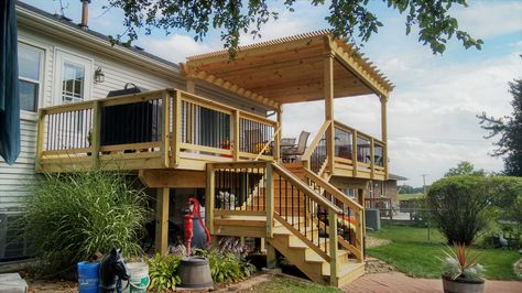 This multi level wood deck with pergola was custom designed and built in Carol Stream, IL by Archadeck of Chicagoland. Split Level Deck, Wood Deck Designs, Click Logo, Wood Decks, Deck Remodel, Multi Level Deck, Patio Deck Designs, Pergola Ideas, Deck Builders