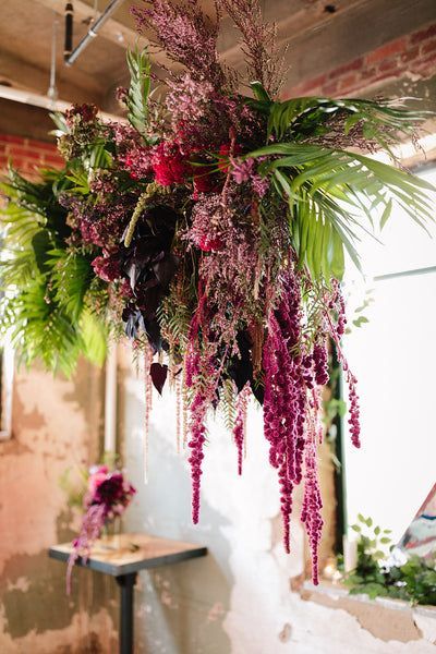 This hanging floral installation is giving us all of the boho vibes! | wedding, wedding planning, floral event design, boho wedding, elegant wedding, modern wedding, simple wedding decor, wedding decor, 2023 bride, dream wedding, wedding inspiration, lace wedding dress, floral arrangements, wedding design, event design, floral design, florist, dc wedding, dc florist, washington dc wedding, wedding photos, wedding guest list, wedding ideas, wedding ceremony, wedding photography, suspended floral Guest List Wedding Ideas, Guest List Wedding, Hanging Floral Installation, Simple Wedding Decor, Wedding Dress Floral, Simple Wedding Decorations, Modern Flowers, Floral Installation, Flower Chandelier