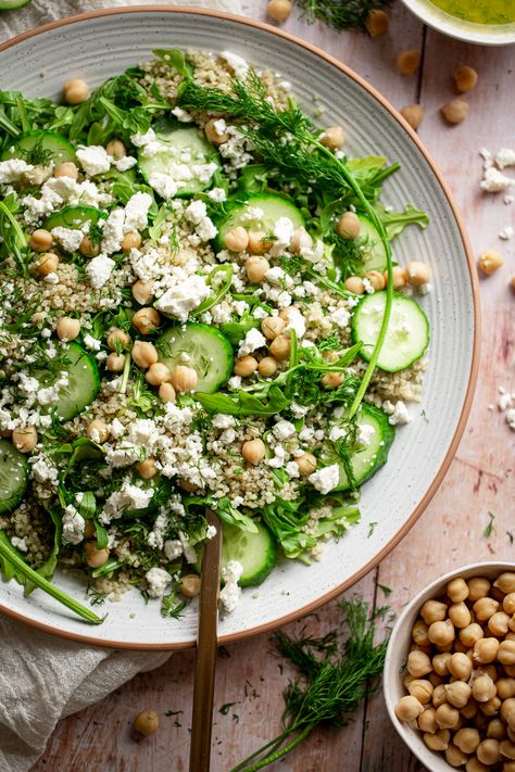 cucumber dill salad on a large plate with chickpeas and feta Quinoa Salad Cucumber, Spring Quinoa Salad, Arugula Quinoa Salad, Chickpea Dill Salad, Dill Chickpea Salad, Work Salads, Quinoa Arugula Salad, Cucumber Quinoa Salad, Hearty Salad Recipes