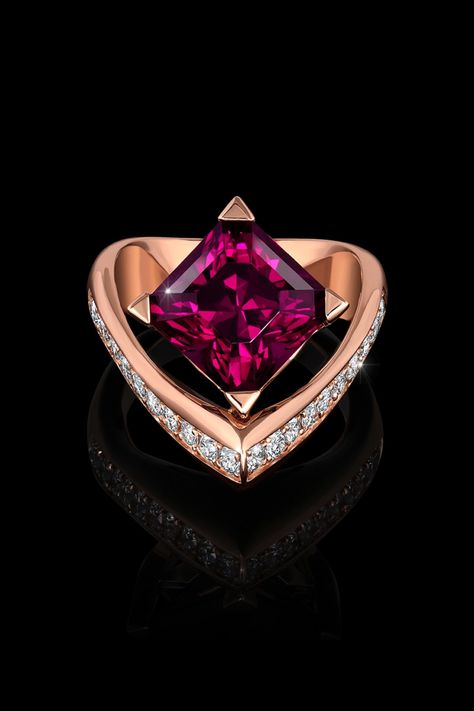 Voila Garnet Ring is poised and passionate. This unique asymmetrically designed ring features a magnificently cut garnet cut by master lapidary Stephen Avery. It is crafted in Adam’s innovative AlbaGold™ and accented by channel set diamonds. Ring Sculpture, Royal Blue Sapphire Ring, Magic Academy, Wearable Sculpture, Tahitian Pearl Ring, Purple Sapphire Ring, Champagne Diamond Rings, Award Winning Jewelry, Red Garnet Ring