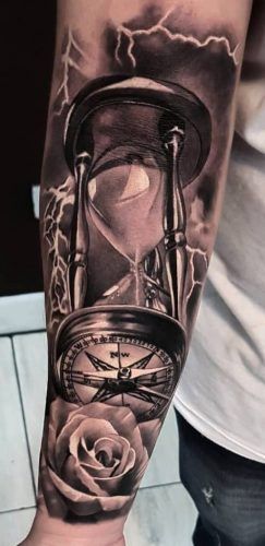 Find Your Direction: 20 Compass Tattoo Ideas for Men Hourglass With Roses Tattoo, Compass Watch Tattoo Design, Mens Time Tattoos, Clock Tattoo Design For Men Leg, Mens Hourglass Tattoo Ideas, Hourglass And Compass Tattoo, Hourglass Design Tattoo, Pocket Watch Compass Tattoo, Hourglass Compass Tattoo