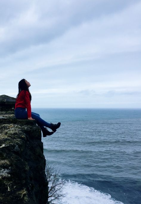 Sitting by the cliff Sitting On A Cliff Pose, Sitting On Cliff Edge, Cliff Picture Poses, Sitting On The Edge Of A Cliff, Cliff Poses, Sitting On Cliff, Sitting By The Ocean, Cliffs Tattoo, Sitting On A Cliff