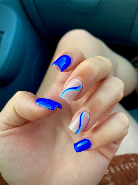 blue acrylic nails with swirl design Blue Nails With Line Design, Electric Blue Nails With Design, Blue Nails With White Lines, Blue Nails Swirl, Blue Nails With Accent Nail, Short Nails Acrylic Blue, Bright Blue Nails With Design, Blue Nails Swirl Design, Wave Nails Design