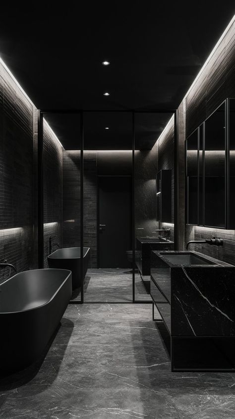 Discover the allure of an elegantly designed bathroom that exudes sophistication and tranquility. With its sleek matte black finishes, this luxurious space combines modern aesthetics with a timeless charm. From the stunning fixtures to the soft ambient lighting, every detail is meticulously crafted to transform your daily routine into a spa-like experience. Get inspired to create your own oasis of relaxation and style! ✨🖤 Luxurious Black Bathroom, Black House Bathroom, All Black House Interiors, All Black Home, Villains Lair, All Black Interior, All Black House, Dark Houses, Lighting Bathroom Vanity