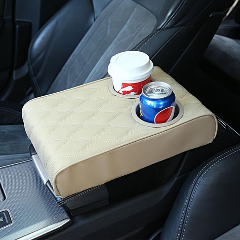 PRICES MAY VARY. 【New design】: Car Armrest Cushion with Cup Holder(3.14 Inch).Family and friends use cup holders for coffee, drinks, water cups,They will enjoy riding in your car. 【Dimension】:Car Armrest Cover(12.5*8.6*2.75 Inch) which fits the center console of most vehicles, SUVs, trucks, cars, vans, cars . Before placing an order, you should measure your car console before making a decision. 【High Quality】: Automobile armrest cover is made of high-quality micro fiber leather, which is very th Winter Car Accessories, Car Console Cover, Clean Car Mats, Must Have Car Accessories, Amazon Items, New Car Accessories, Car Console, Winter Car, Bff Birthday Gift