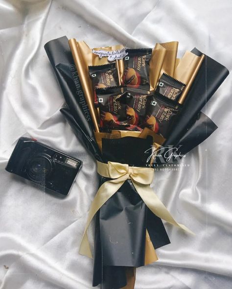 Dark fantasy bouquet 🤎 . Gift this prettiest bouquet for your close ones! Can be customised with any kind of chocolates or snacks ! . DM us for orders & queries. 📍 Khan graphics sirsi +91 8095439817 . . . . . . . . . . . . . #bouquet #chocolatebouquet #weddingbouquet #engagementgifts #custombouquet #customgifts #darkfantasy #biscuitbouquets #snackslove #snackbouquet #custommade #trulycustomised Chocolate Bouquet Ideas Creative, Chocolate Bouquet Ideas, Snacks Bouquet, Fantasy Bouquet, The Best Aesthetic, Girly Christmas Gifts, Girly Christmas, Best Aesthetic, Wedding Invitation Background